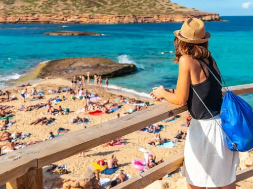 A tourist on Cala Comte beach on the island of Ibiza Sunset Balearic
